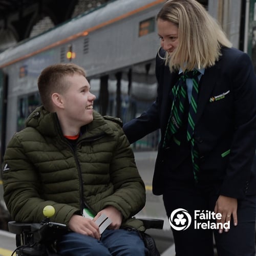 Passenger in wheelchair gets assistance at train station